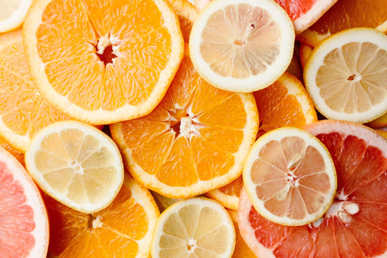 Flat lay of slices of citrus fruits, grapefruit and lemon